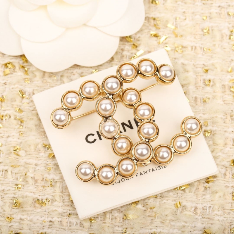 Ch**el brooches